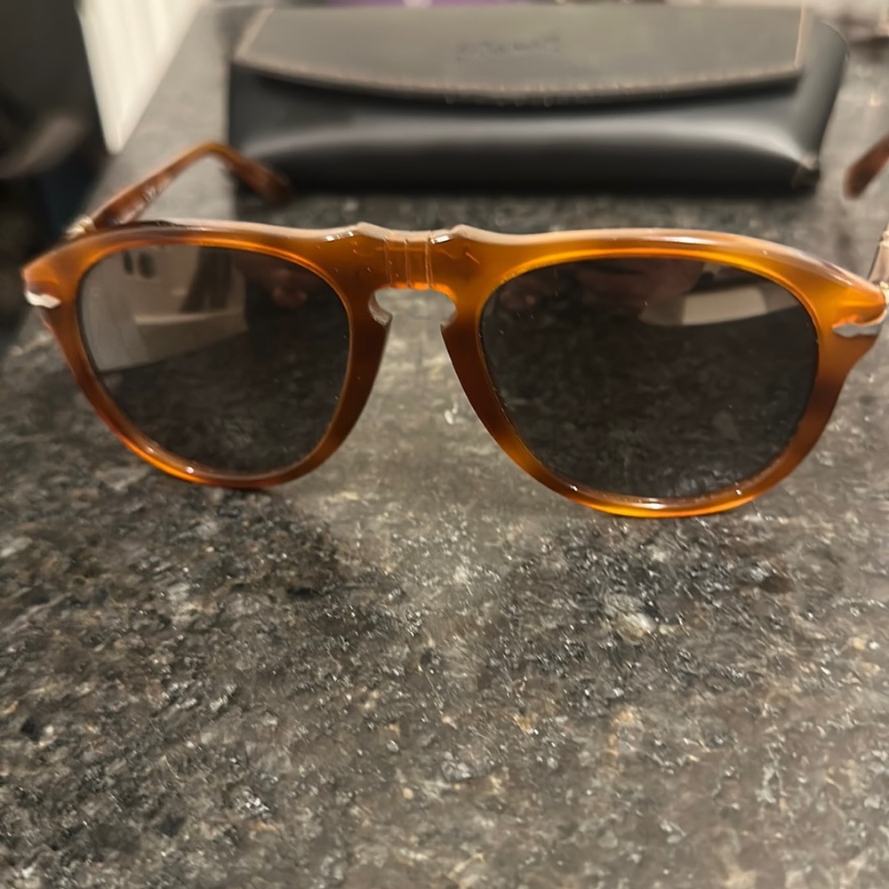 Persol’s (like new with original box, case and washcloth). Polarized